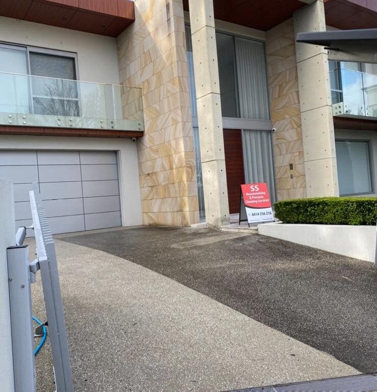 Driveway cleaning Sydney using high pressure washing to remove oil and stains